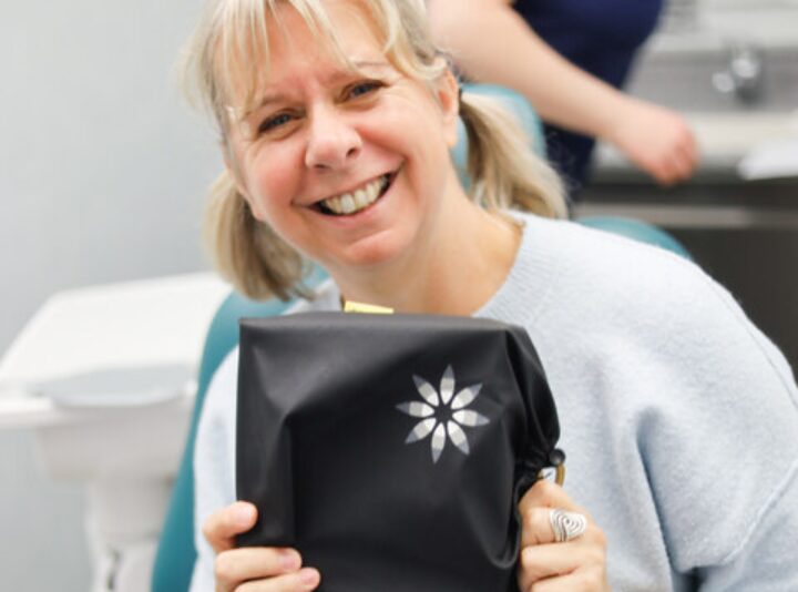 Park Lane Orthodontics patient smiling broadly in the treatment chair