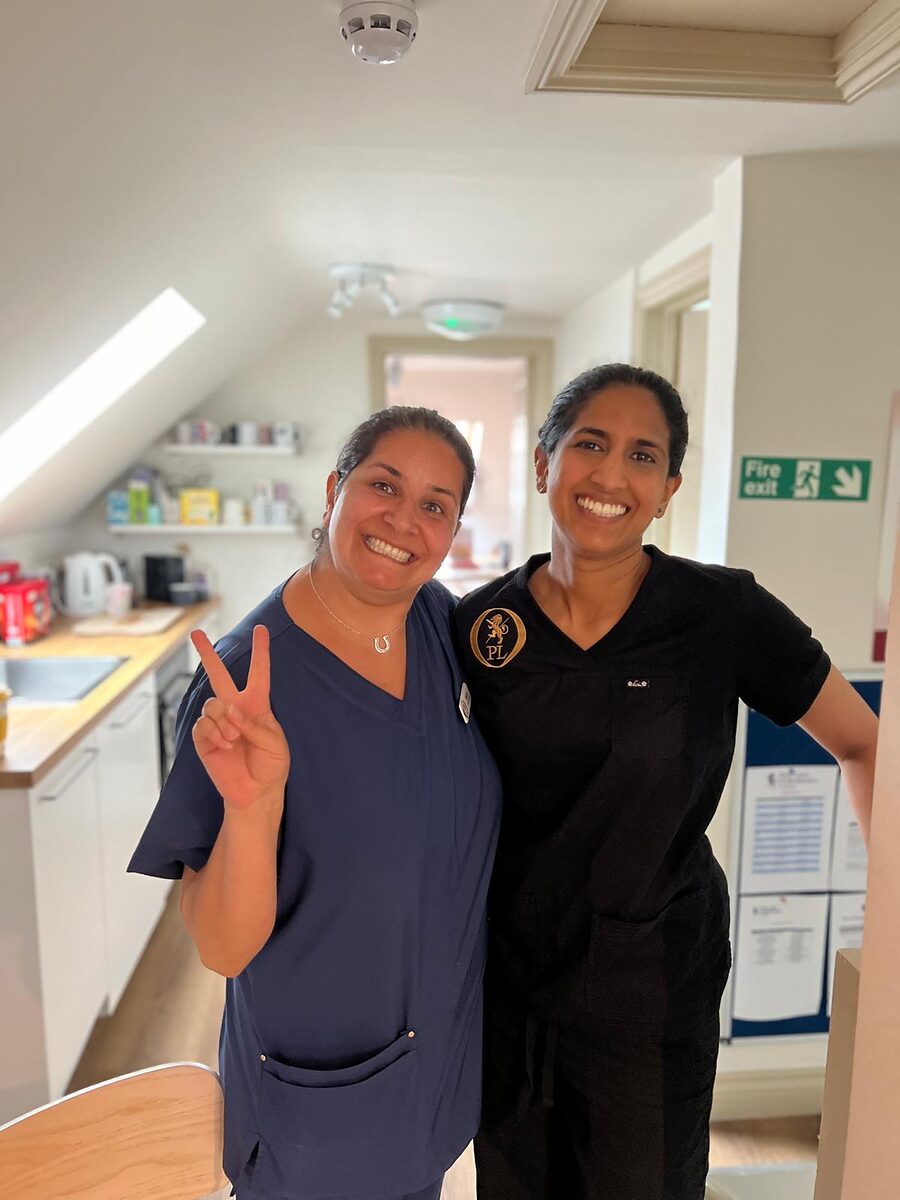 Two Park Lane Orthodontics team members smiling at the practice in Reading