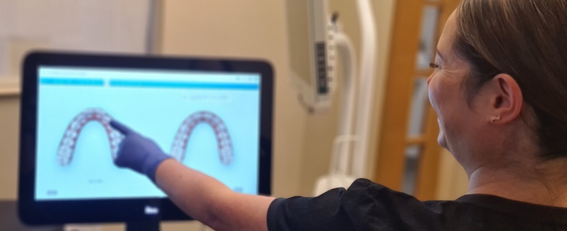 Orthodontic therapist at Park Lane Orthodontics reviewing a digital treatment plan on screen